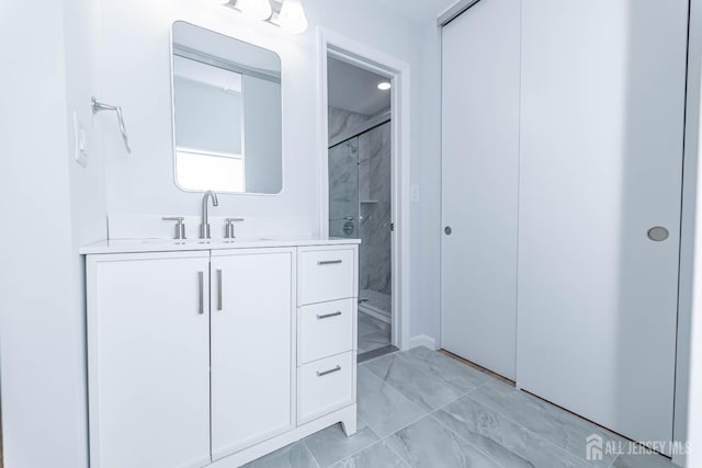 372-B Duranta Plz, Monroe, NJ 08831 - full bathroom with marble look tile flooring, a marble finish shower, and vanity