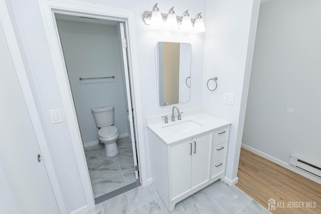 372-B Duranta Plz, Monroe, NJ 08831 - bathroom featuring vanity, marble finish flooring, and a baseboard heating unit