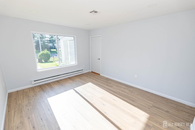 372-B Duranta Plz, Monroe, NJ 08831 - spare room featuring a baseboard radiator and wood finished floors
