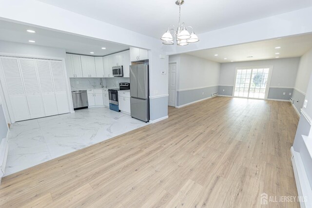 372-B Duranta Plz, Monroe, NJ 08831 - unfurnished living room with a chandelier and recessed lighting