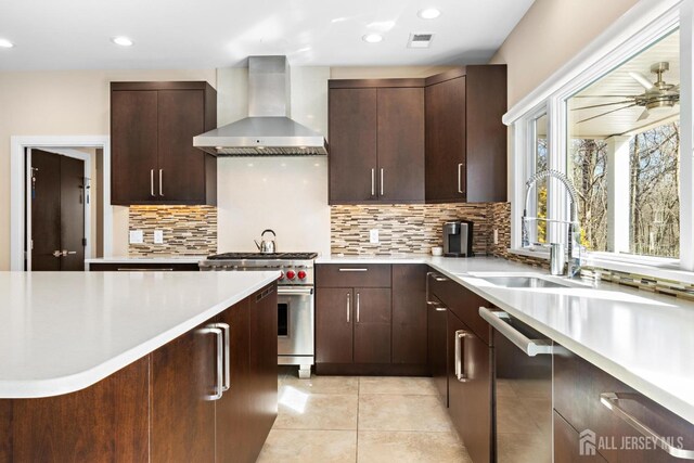 6 Alex Ct, Monroe, NJ 08831 - kitchen featuring wall chimney exhaust hood, appliances with stainless steel finishes, light countertops, decorative backsplash, and a sink