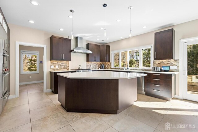 6 Alex Ct, Monroe, NJ 08831 - kitchen featuring wall chimney range hood, tasteful backsplash, dark brown cabinets, light countertops, and recessed lighting