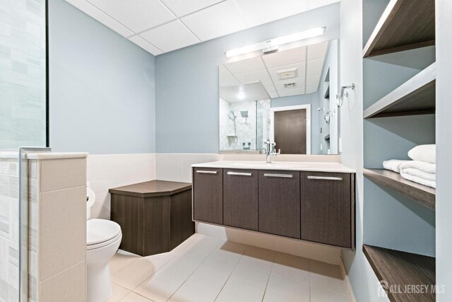 6 Alex Ct, Monroe, NJ 08831 - bathroom with a drop ceiling, a stall shower, tile patterned flooring, vanity, and toilet
