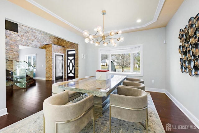6 Alex Ct, Monroe, NJ 08831 - dining space featuring dark wood finished floors, a chandelier, a tray ceiling, baseboards, and crown molding