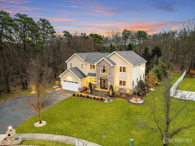 6 Alex Ct, Monroe, NJ 08831 - traditional-style home with stone siding, driveway, stucco siding, and a yard
