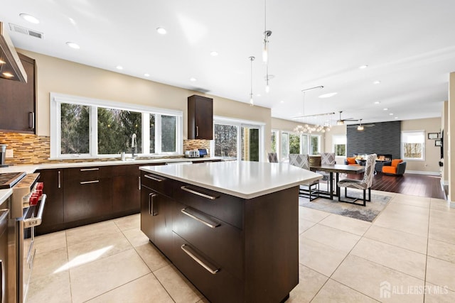 6 Alex Ct, Monroe, NJ 08831 - kitchen featuring double oven range, a sink, decorative backsplash, a center island, and recessed lighting