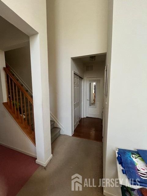 47 Stony Path Dr, South Brunswick, NJ 08810 - hall featuring stairway, carpet, and baseboards