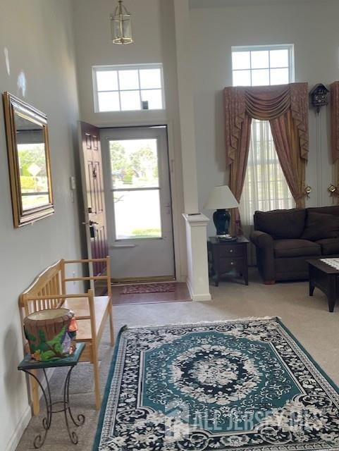 47 Stony Path Dr, South Brunswick, NJ 08810 - entrance foyer featuring a towering ceiling, light colored carpet, and baseboards