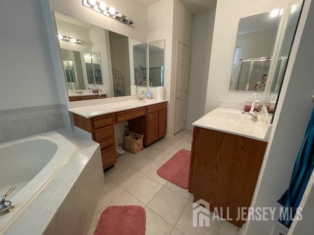 47 Stony Path Dr, South Brunswick, NJ 08810 - full bathroom with tile patterned flooring, a shower stall, two vanities, and a bath