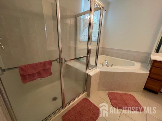 47 Stony Path Dr, South Brunswick, NJ 08810 - bathroom featuring a garden tub, a stall shower, tile patterned floors, and vanity