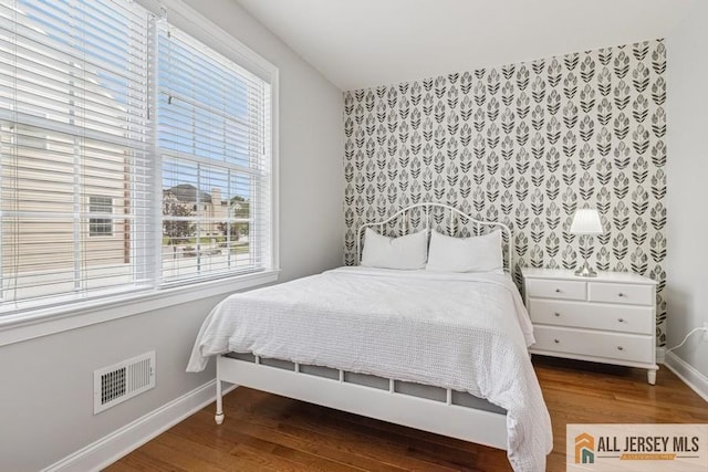 20 Washingtons Xing, Monroe, NJ 08831 - bedroom featuring baseboards, wood finished floors, and an accent wall