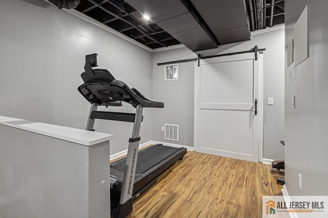 20 Washingtons Xing, Monroe, NJ 08831 - workout area featuring a barn door and light wood finished floors