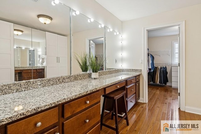 20 Washingtons Xing, Monroe, NJ 08831 - bathroom with vanity, wood-type flooring, baseboards, and a walk in closet