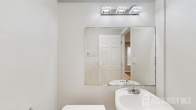 46 Carriage Dr, Piscataway, NJ 08854 - half bathroom featuring toilet and a sink