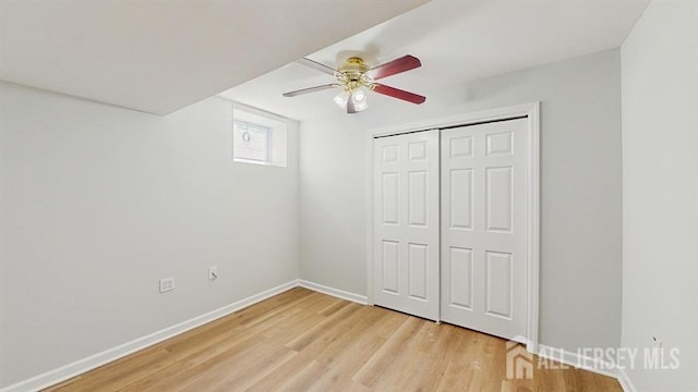 46 Carriage Dr, Piscataway, NJ 08854 - unfurnished bedroom with light wood-style flooring, baseboards, a ceiling fan, and a closet