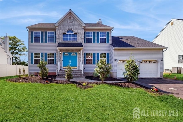 46 Carriage Dr, Piscataway, NJ 08854 - view of front of property featuring asphalt driveway, entry steps, an attached garage, and a chimney