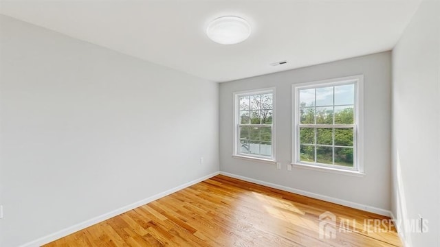 46 Carriage Dr, Piscataway, NJ 08854 - spare room featuring baseboards and light wood finished floors