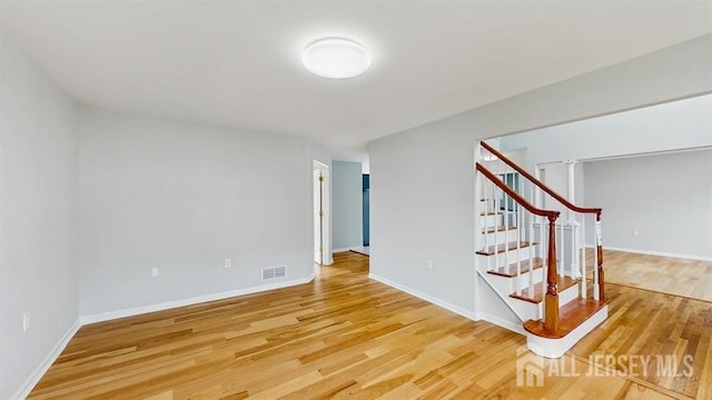 46 Carriage Dr, Piscataway, NJ 08854 - staircase with wood finished floors and baseboards