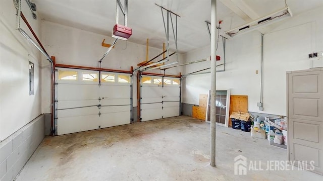 46 Carriage Dr, Piscataway, NJ 08854 - garage featuring a garage door opener and electric panel