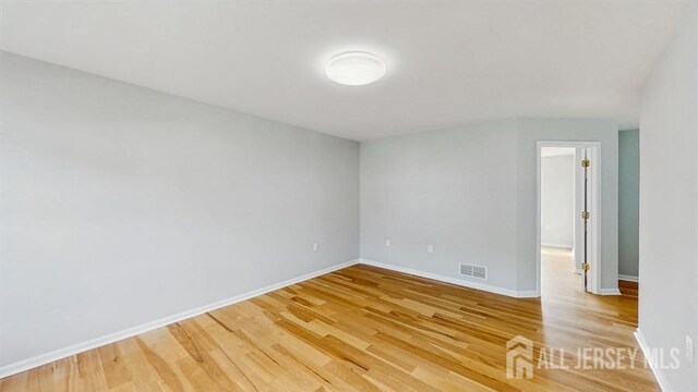 46 Carriage Dr, Piscataway, NJ 08854 - empty room featuring light wood-style flooring and baseboards