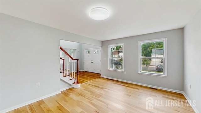 46 Carriage Dr, Piscataway, NJ 08854 - entryway featuring stairs, wood finished floors, and baseboards