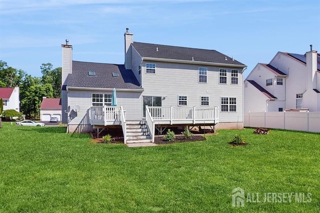 46 Carriage Dr, Piscataway, NJ 08854 - rear view of house with a wooden deck and a chimney