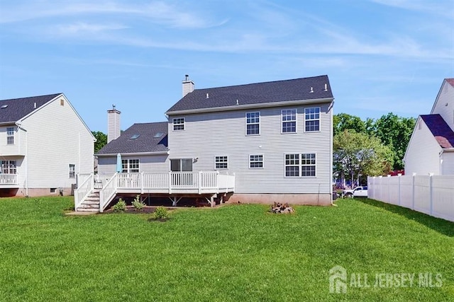 46 Carriage Dr, Piscataway, NJ 08854 - back of property featuring a wooden deck and a chimney