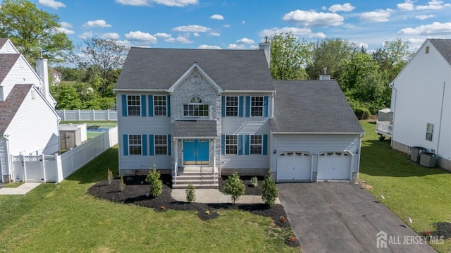 46 Carriage Dr, Piscataway, NJ 08854 - colonial inspired home with driveway, roof with shingles, a garage, a chimney, and cooling unit