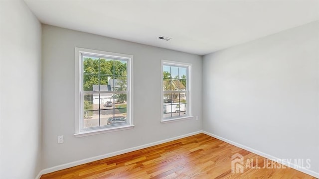 46 Carriage Dr, Piscataway, NJ 08854 - empty room featuring baseboards and light wood-style flooring