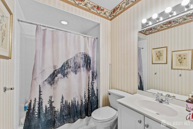 bathroom with vanity, toilet, and a shower with shower curtain