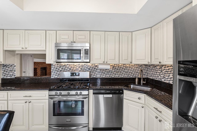 251 Chaucer Ct, Old Bridge, NJ 08857 - kitchen with appliances with stainless steel finishes, a sink, decorative backsplash, white cabinets, and dark stone countertops