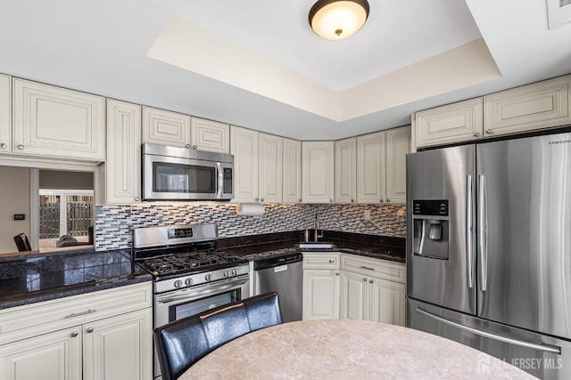 251 Chaucer Ct, Old Bridge, NJ 08857 - kitchen with appliances with stainless steel finishes, a raised ceiling, a sink, and decorative backsplash