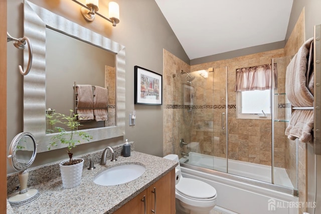 4 Rieder Ct, Franklin Twsp, NJ 08873 - bathroom featuring vanity, bath / shower combo with glass door, vaulted ceiling, and toilet