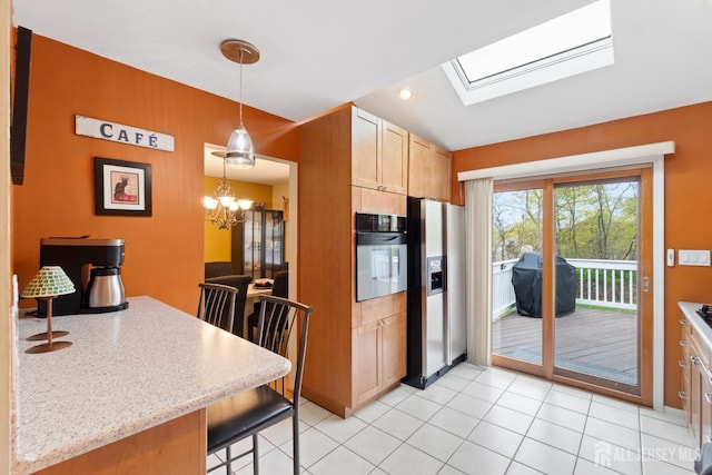 4 Rieder Ct, Franklin Twsp, NJ 08873 - kitchen featuring oven, a notable chandelier, decorative light fixtures, stainless steel refrigerator with ice dispenser, and a skylight