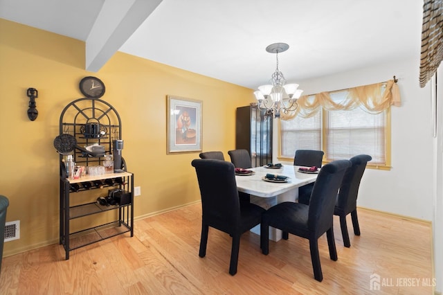 4 Rieder Ct, Franklin Twsp, NJ 08873 - dining room featuring light wood-style floors, baseboards, and a chandelier