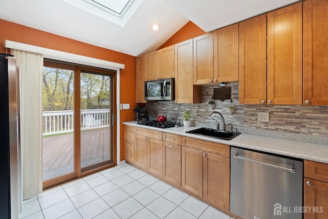 4 Rieder Ct, Franklin Twsp, NJ 08873 - kitchen with a sink, light countertops, stainless steel appliances, tasteful backsplash, and lofted ceiling with skylight