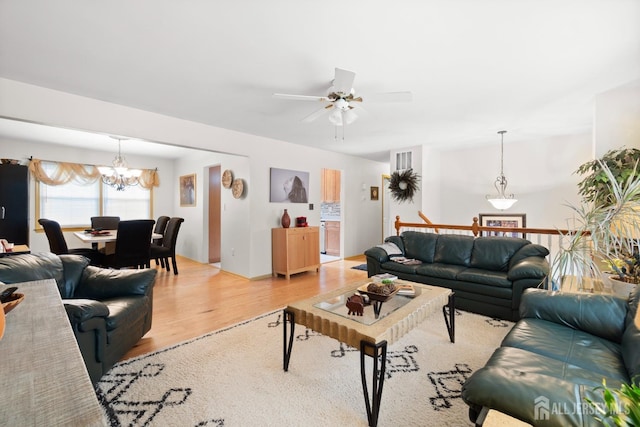 4 Rieder Ct, Franklin Twsp, NJ 08873 - living room featuring visible vents, light wood-style flooring, and ceiling fan with notable chandelier