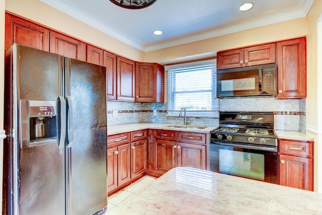 kitchen with light tile patterned floors, a sink, range with gas stovetop, black refrigerator with ice dispenser, and stainless steel microwave