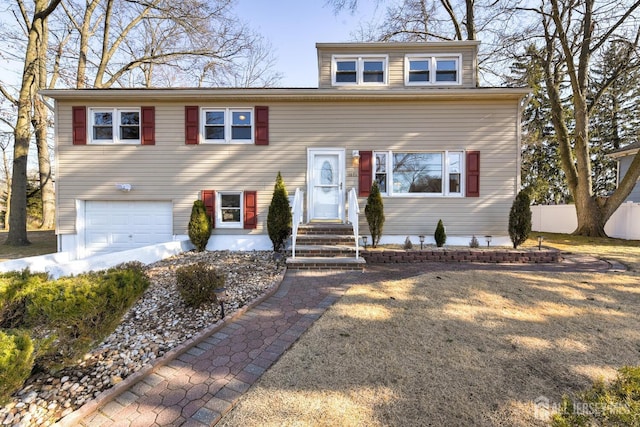 view of front of property featuring entry steps and an attached garage