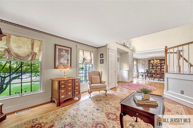35 Parkview Rd, Cranbury, NJ 08512 - living room with a chandelier, wood finished floors, stairway, and ornamental molding
