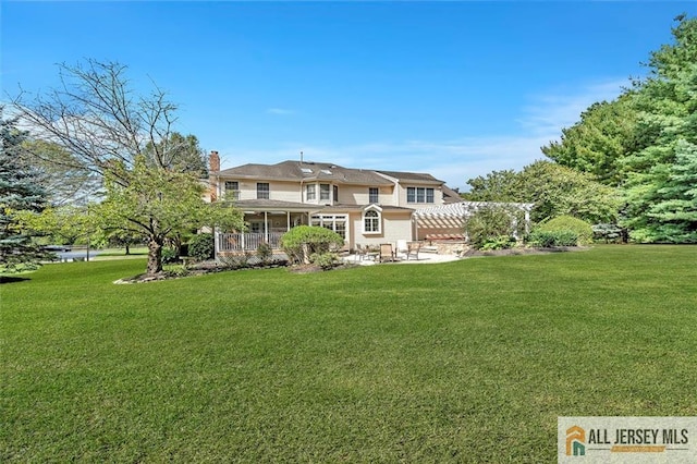 35 Parkview Rd, Cranbury, NJ 08512 - back of house featuring a patio, a lawn, a pergola, and a chimney
