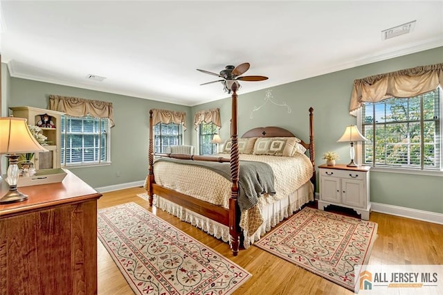 35 Parkview Rd, Cranbury, NJ 08512 - bedroom featuring multiple windows, ornamental molding, wood finished floors, and a ceiling fan