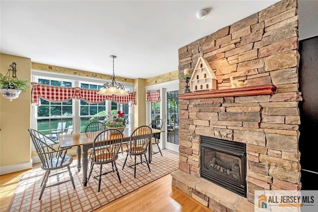 35 Parkview Rd, Cranbury, NJ 08512 - dining area with wood finished floors, a fireplace, and a chandelier