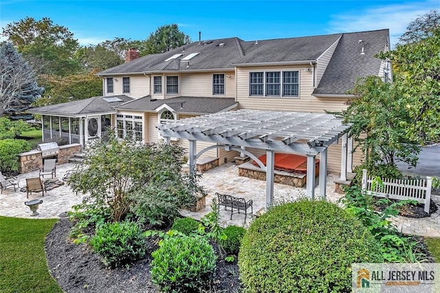 35 Parkview Rd, Cranbury, NJ 08512 - back of property with a patio area, a pergola, a sunroom, an outdoor kitchen, and a chimney