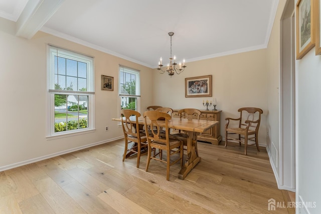 26 Magnolia Rd, Franklin Twsp, NJ 08873 - dining room with crown molding, light wood-style floors, a chandelier, and baseboards