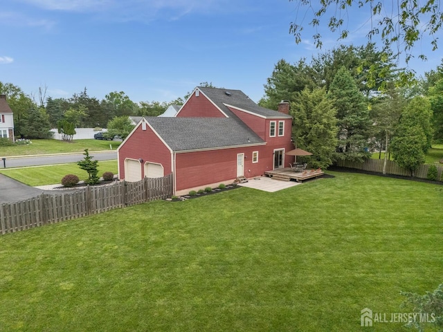 26 Magnolia Rd, Franklin Twsp, NJ 08873 - rear view of property with a wooden deck, a chimney, and roof with shingles