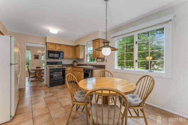 26 Magnolia Rd, Franklin Twsp, NJ 08873 - dining space with light tile patterned flooring and baseboards