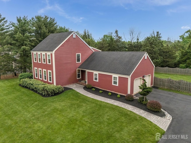 26 Magnolia Rd, Franklin Twsp, NJ 08873 - view of home's exterior with roof with shingles, asphalt driveway, and an attached garage