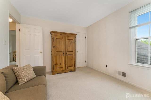 26 Magnolia Rd, Franklin Twsp, NJ 08873 - unfurnished living room featuring light colored carpet and baseboards