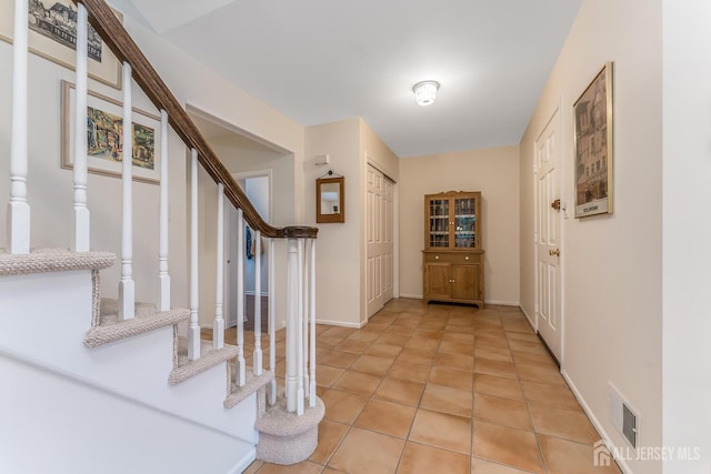 26 Magnolia Rd, Franklin Twsp, NJ 08873 - foyer featuring stairs, light tile patterned floors, and baseboards